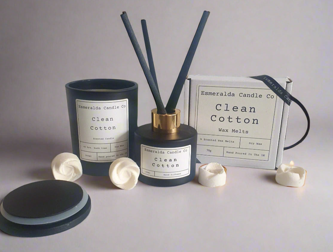 Aromatherapy diffuser with reeds and containers on a tiled surface