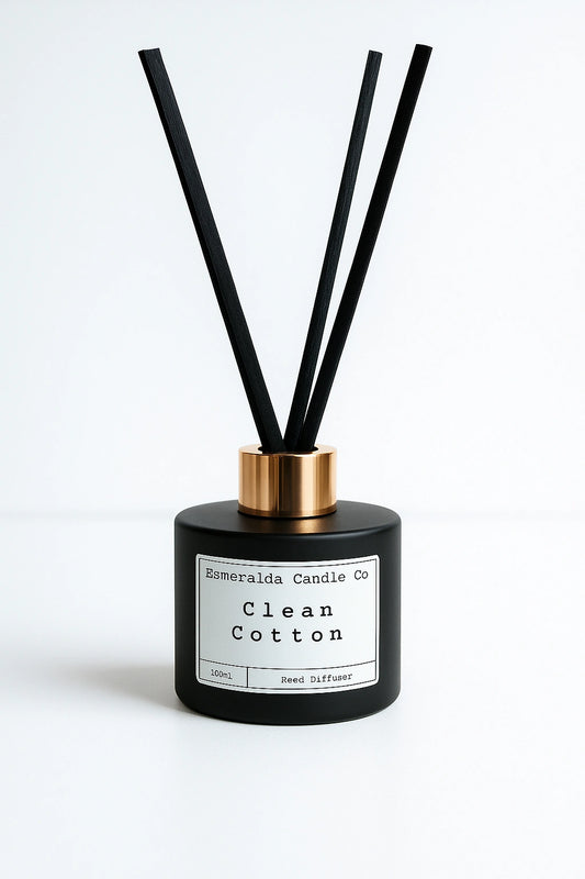 Clean Cotton reed diffuser by Esmeralda Candle Co, 100ml matte black bottle with gold collar and tall black reeds, fresh and crisp home fragrance.