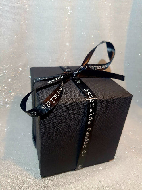 Elegant black gift box with branded Esmeralda Candle Co ribbon, perfect for luxury candle and home fragrance gifting.