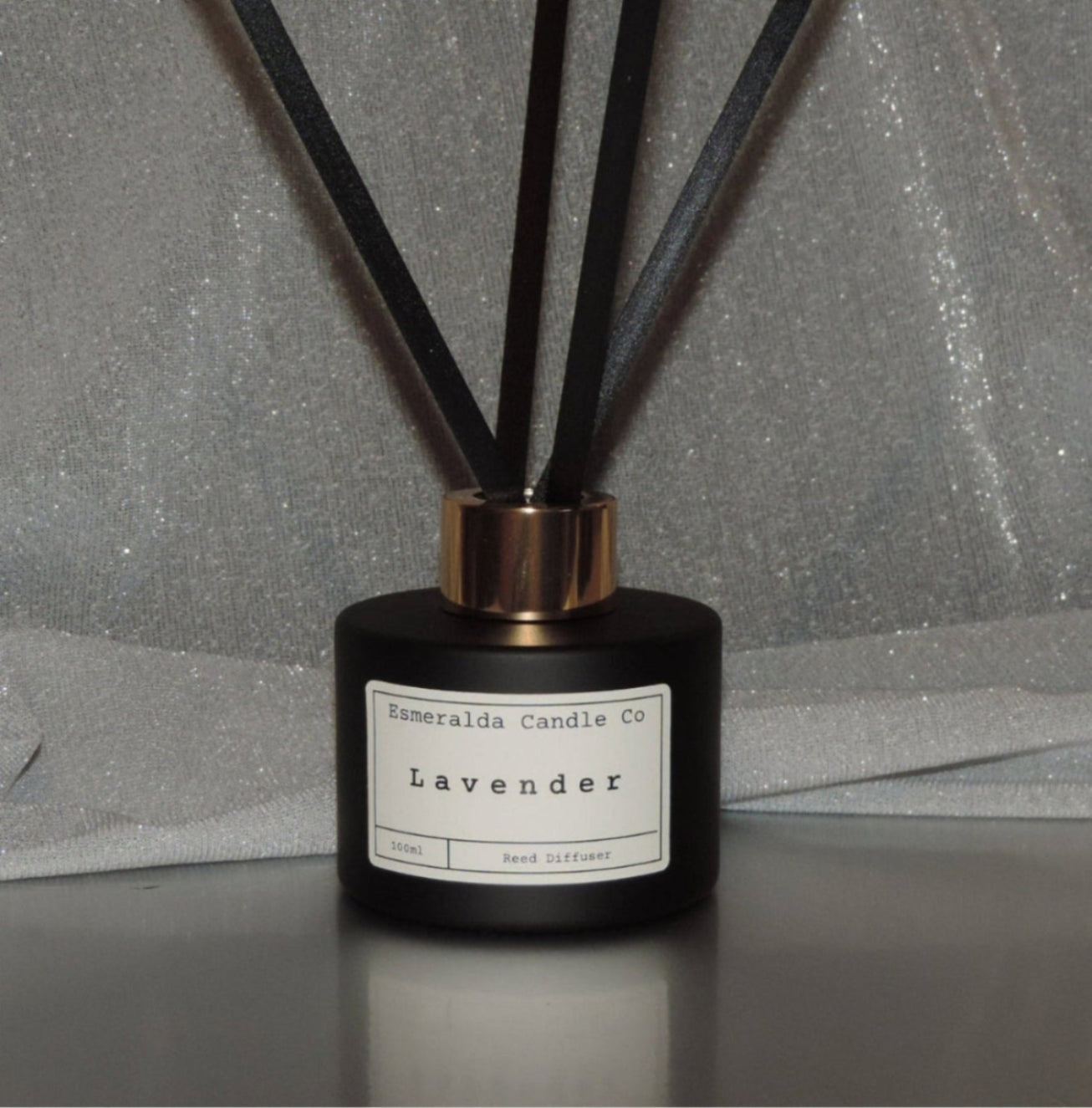 reed diffuser scent clean cotton by Esmeralda candle co, 100ml matt black glass and gold lid with 4 reeds