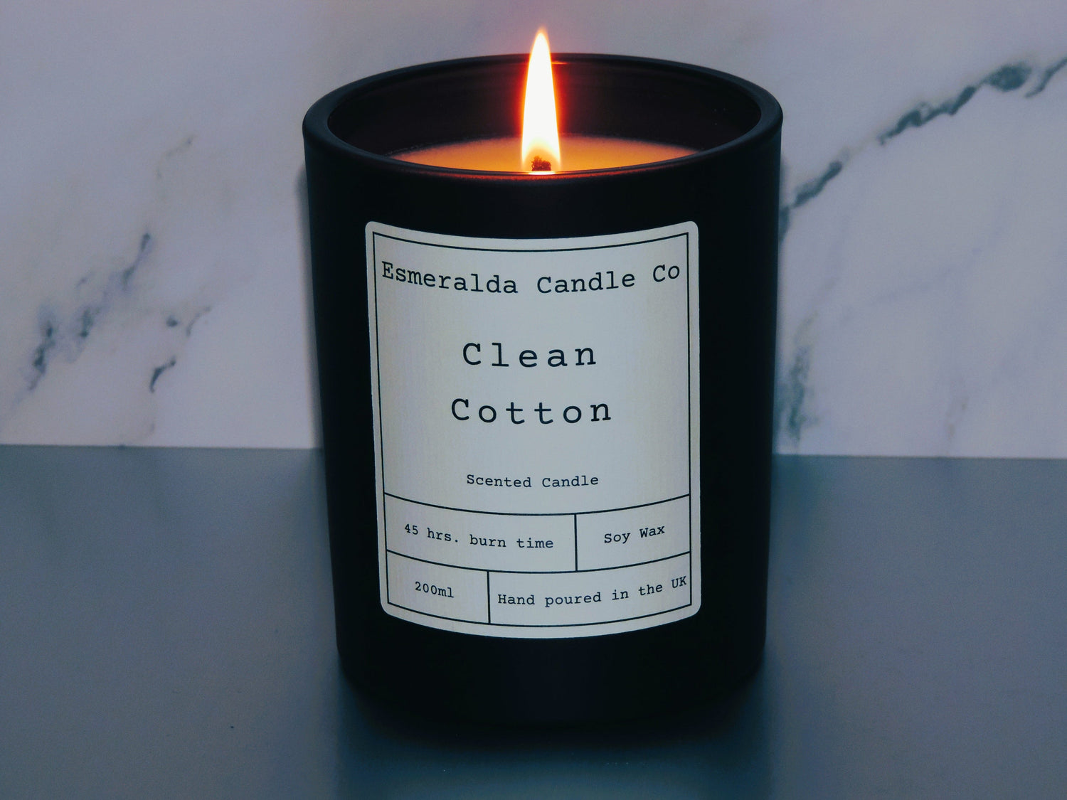 black cherry scented candle by Esmeralda candle co, soy wax with fragrance oil in a matt black glass jar 200ml.