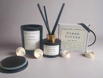 Aromatherapy diffuser with reeds and containers on a tiled surface