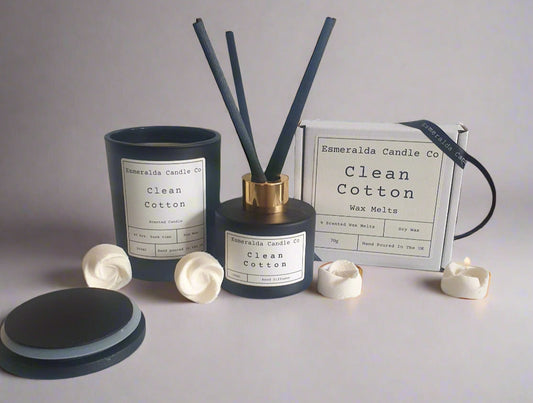Aromatherapy diffuser with reeds and containers on a tiled surface