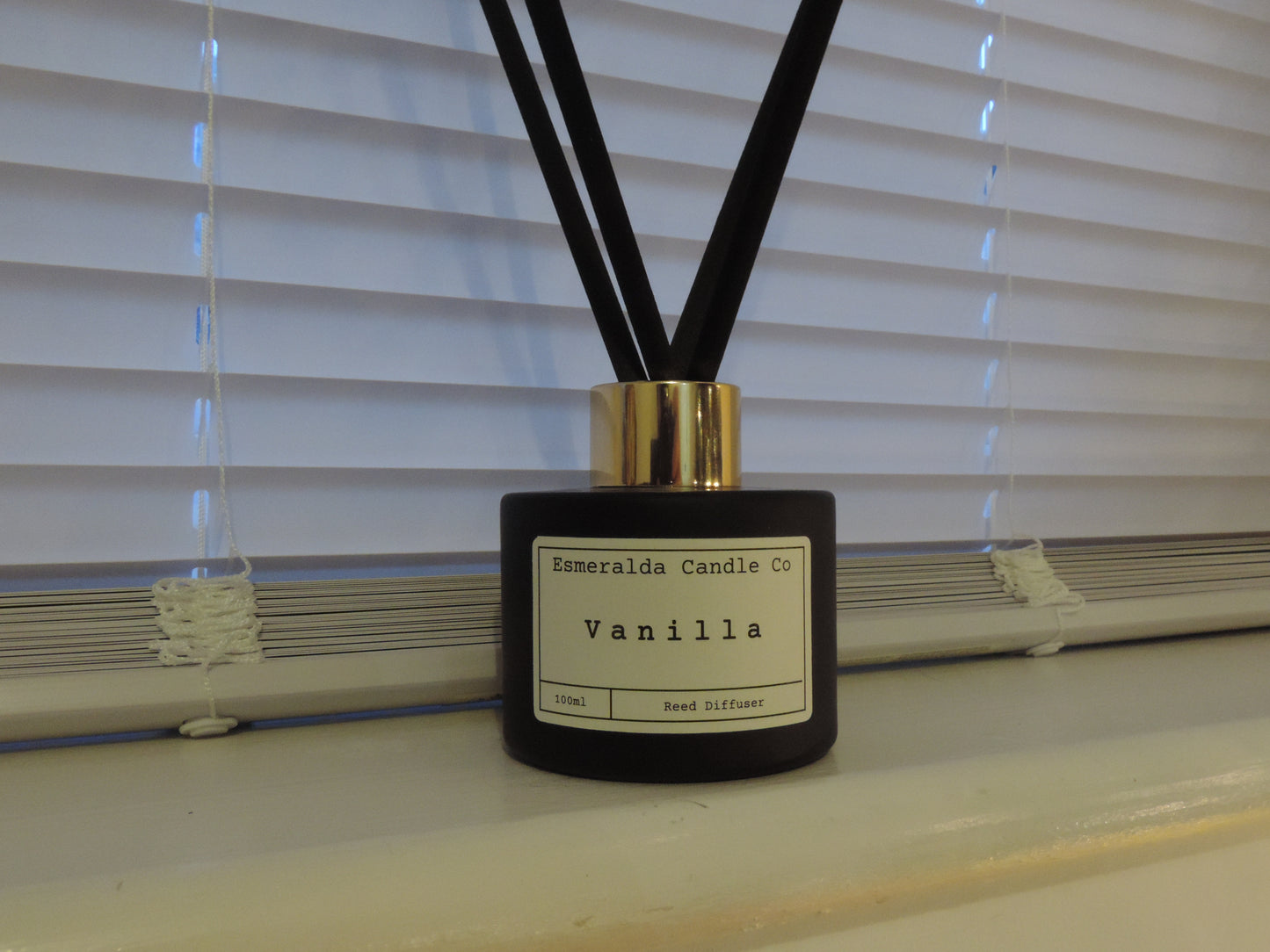 Vanilla scented reed diffuser in this matt black glass 100ml with 4 reeds by Esmeralda candle co