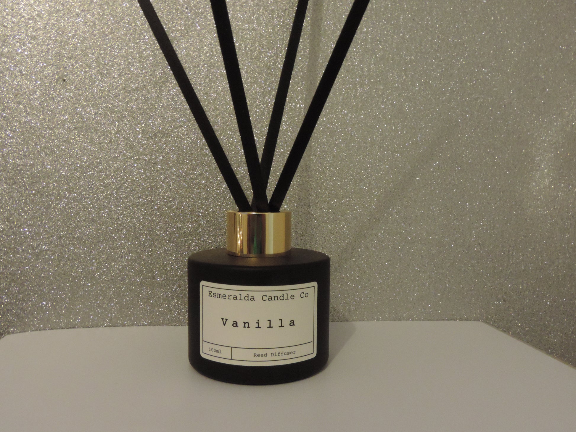 Vanilla scented reed diffuser in this matt black glass 100ml with 4 reeds by Esmeralda candle co