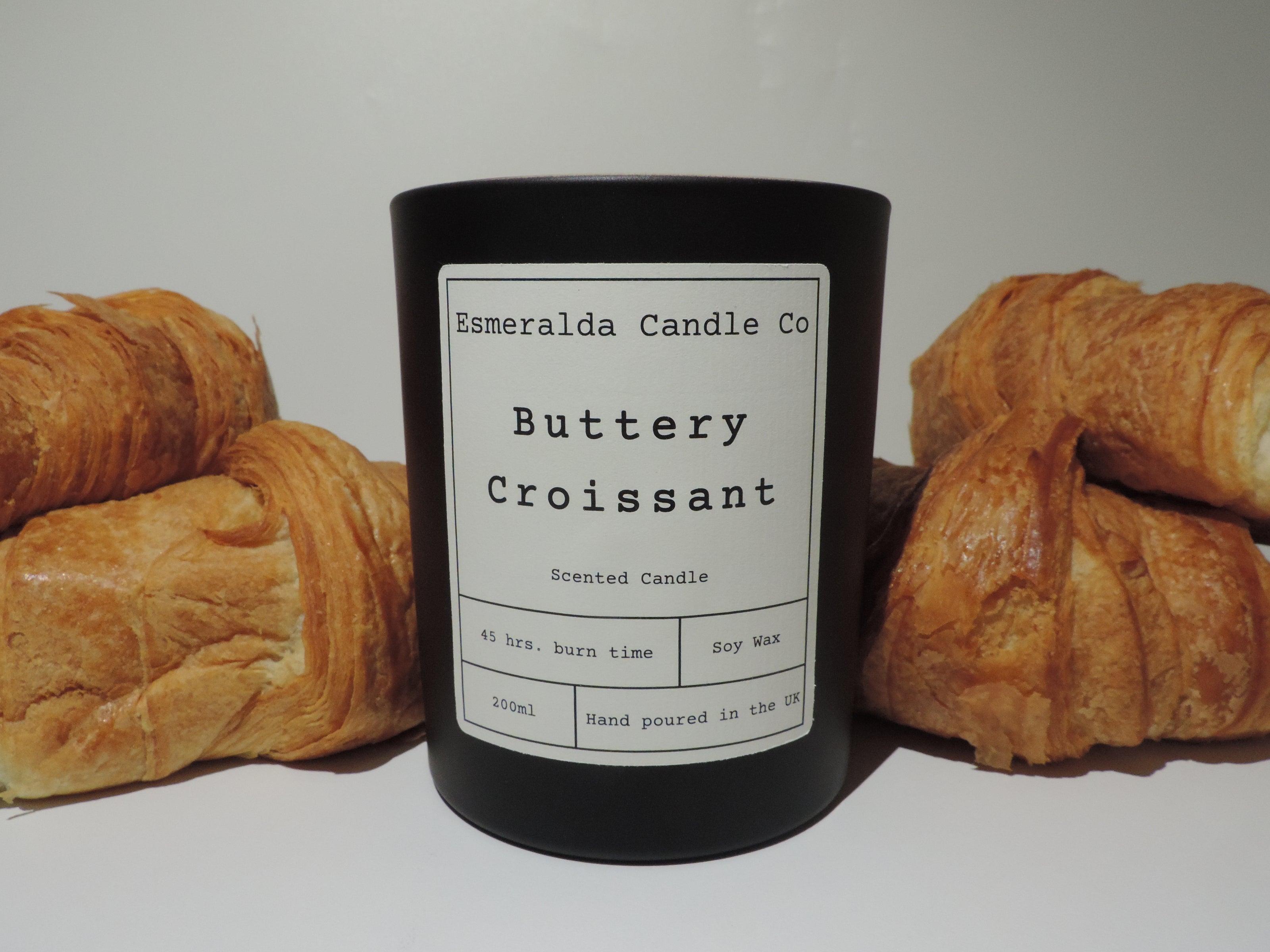  Buttery Croissant Scented Candle in black glass with croissants