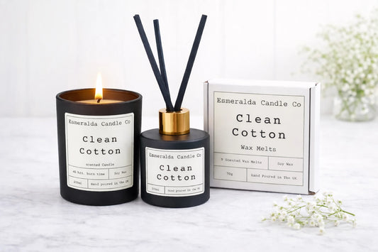 Esmeralda Candle Co 'Clean Cotton' candle and diffuser set on a white surface with a white background.