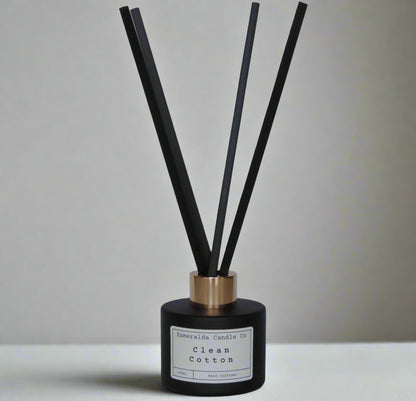 Clean Cotton reed diffuser by Esmeralda Candle Co, 100ml matte black bottle with gold collar and tall black reeds, fresh and crisp home fragrance.