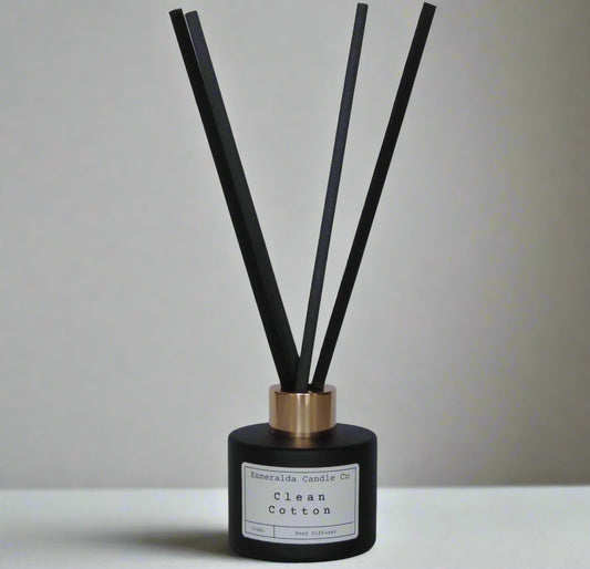 Clean Cotton reed diffuser by Esmeralda Candle Co, 100ml matte black bottle with gold collar and tall black reeds, fresh and crisp home fragrance.