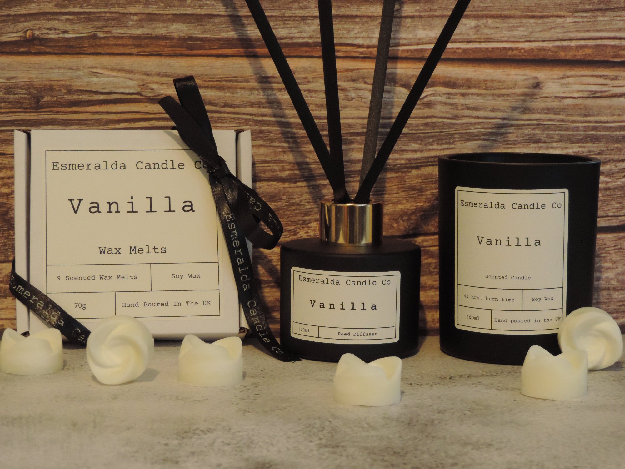 vanilla scented gift set. black glass reed diffuser, black glass candle and white box of wax melts