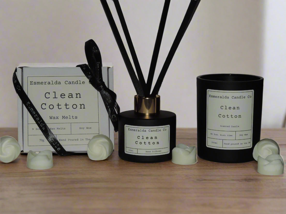 a gift set, black glass reed diffuser, glass black candle and white box of wax melts