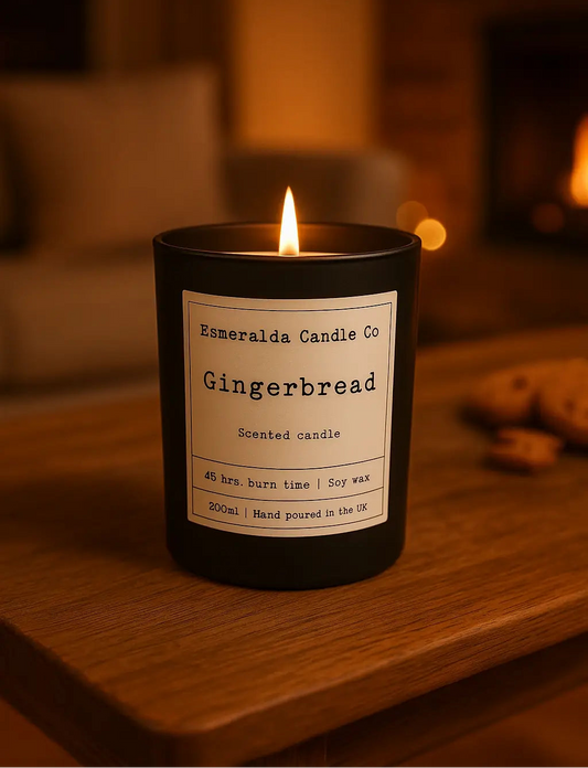 Gingerbread scented candle from Esmeralda Candle Co on a wooden surface with a warm background.