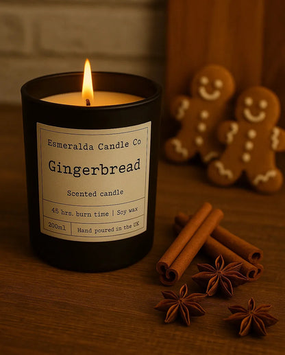 Gingerbread scented candle by Esmeralda Candle Co — hand-poured soy wax candle with 45-hour burn time, styled with cinnamon sticks, star anise, and gingerbread cookies for a festive holiday feel.