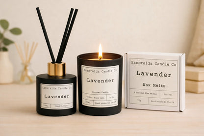 Lavender home fragrance collection by Esmeralda Candle Co featuring a matte black reed diffuser with gold collar, a lit lavender scented candle, and a box of lavender wax melts, styled on a soft neutral background for a calm, spa-like aesthetic.