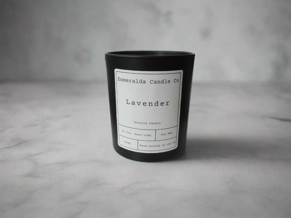 Lavender scented soy wax candle by Esmeralda Candle Co, hand poured in the UK, displayed on a minimalist grey marble surface for clean and elegant product presentation.