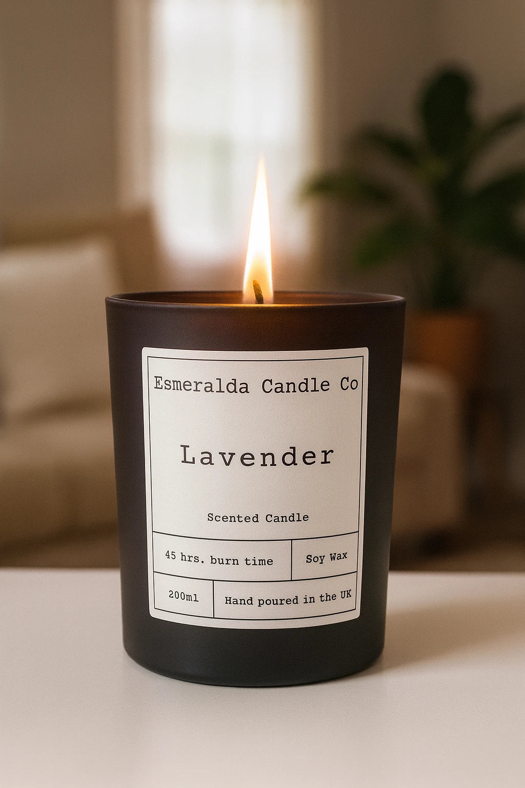 Lavender scented soy wax candle by Esmeralda Candle Co, hand-poured in the UK, displayed in a modern room setting.