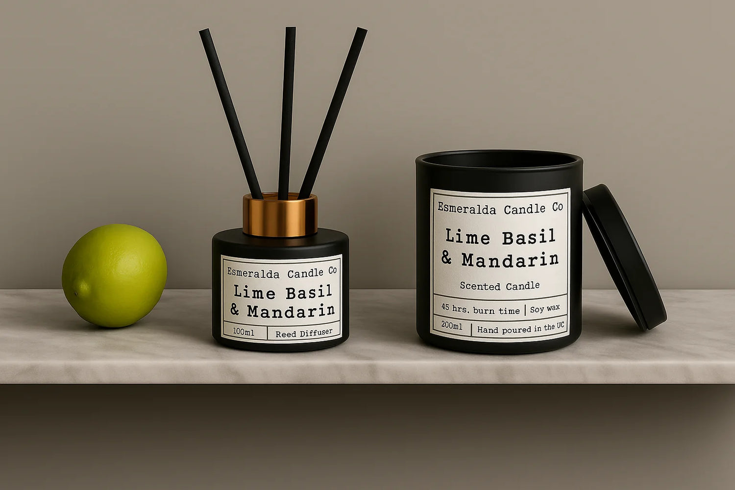 Black candle with a label reading 'Esmeralda Candle Co Lime Basil & Mandarin' on a wooden surface.