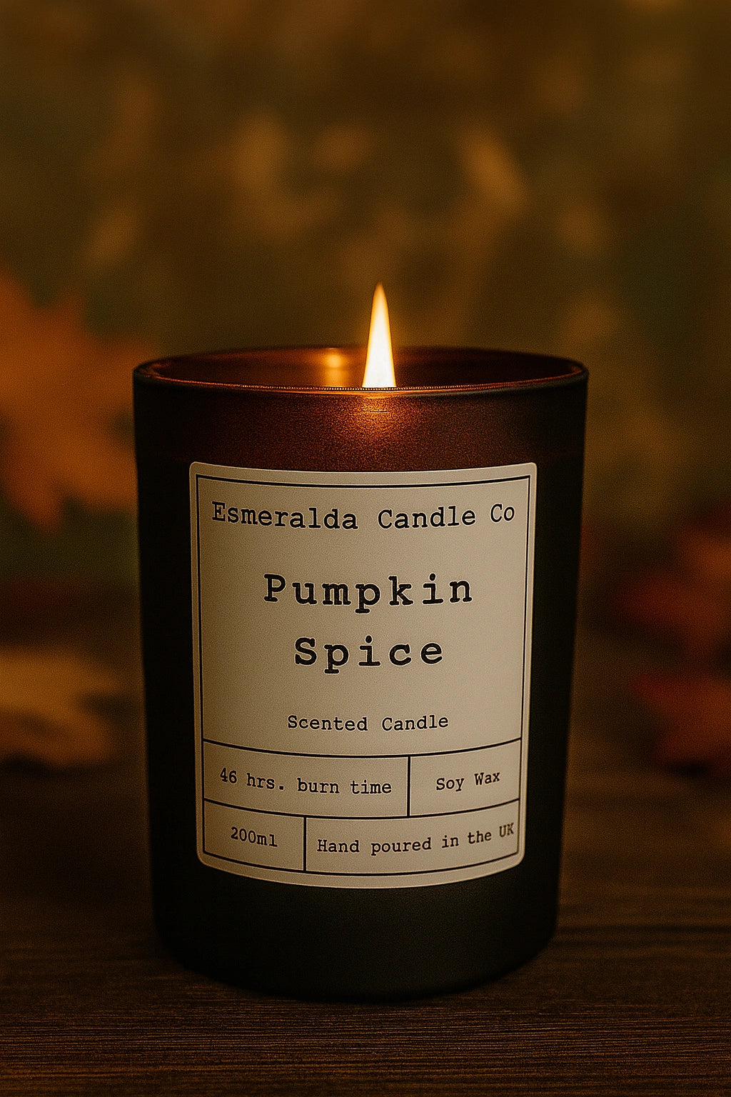 Pumpkin spice candle with a label on a dark background