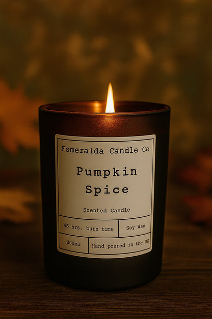 Pumpkin spice candle with a label on a dark background