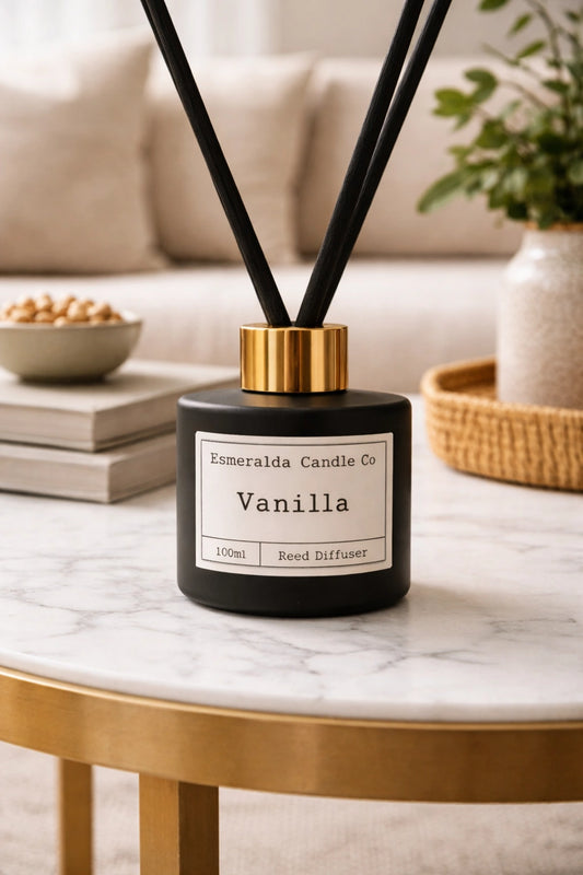 Vanilla reed diffuser by Esmeralda Candle Co on a marble coffee table with gold trim in a modern living room setting