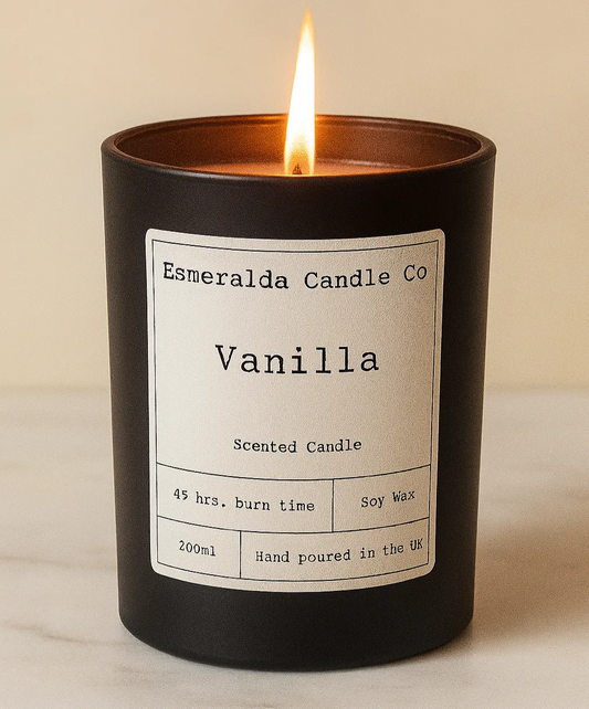 Vanilla scented candle with a label on a beige background made by Esmeralda candle co